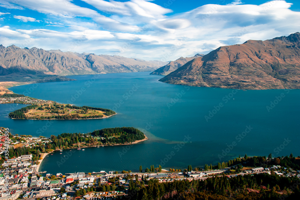 An aerial view of downtown Queenstown, Lake Wakatipu and the Remarkables in the background in Otago, New Zealand