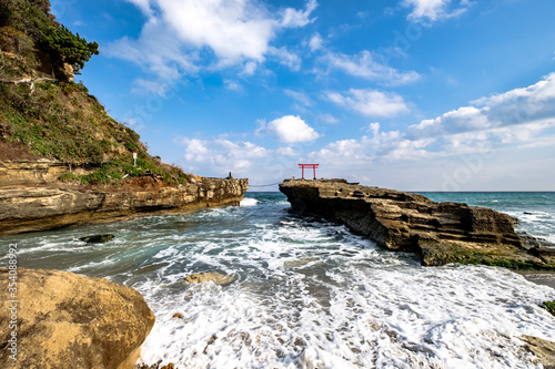 Shirahama Jinja Shrine Torii on the cliff by the shore in Izu Peninsula, Shizuoka, Japan photo