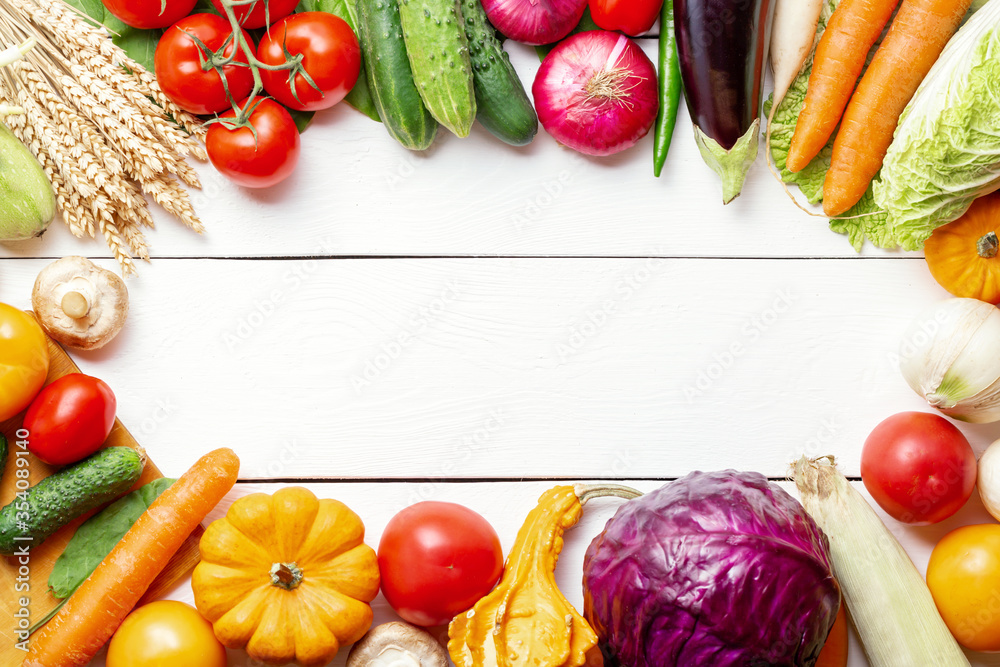 Fresh garden vegetarian food. Autumn seasonal image of farmer table with mushrooms, rye, cucumbers, tomatoes, cabbage, pumpkin, eggplant and other. Free space. Fresh garden vegetarian food. Autumn seasonal image of farmer table with mushrooms, rye, cucumbers, tomatoes, cabbage, pumpkin, eggplant and other. Free space.