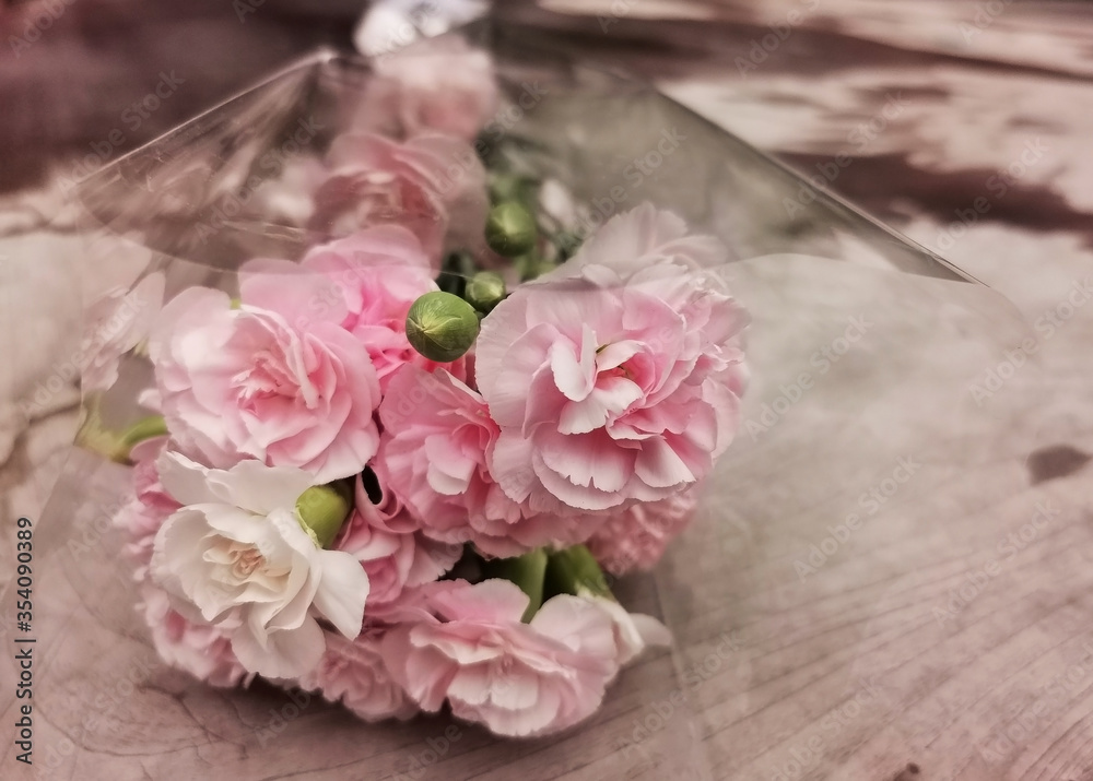 pink flower bouquet on wooden background