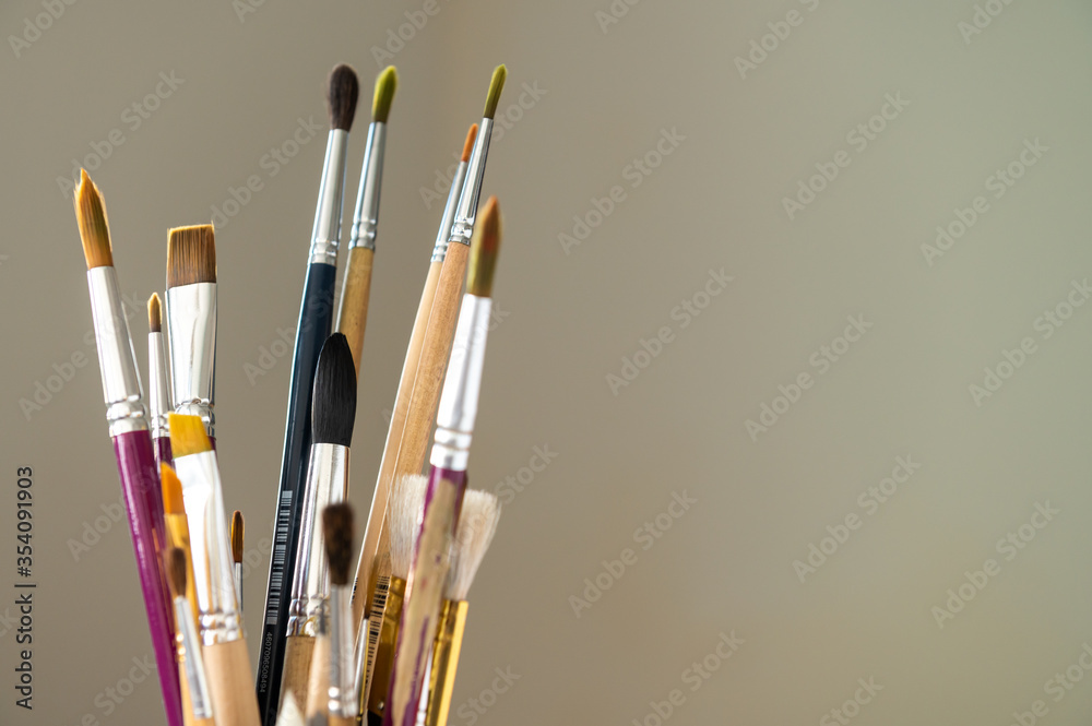 Set of painting brushes on light background Set of painting brushes on light background