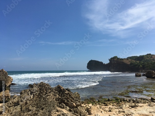 Cliff and Waves in a Tropical country ocean 