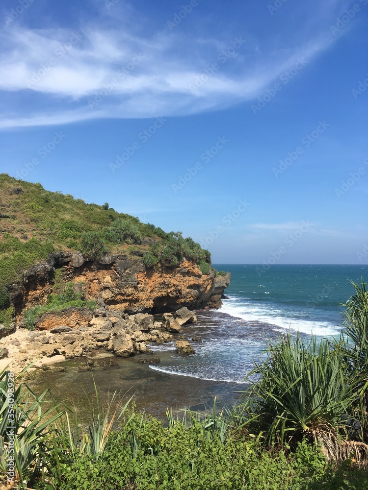 Cliff and Waves in a Tropical country  ocean 