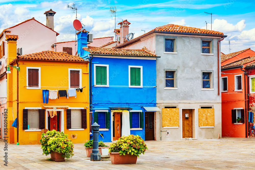 Beautiful colorful small houses at Burano island near Venice, Italy. Famous tourism attraction