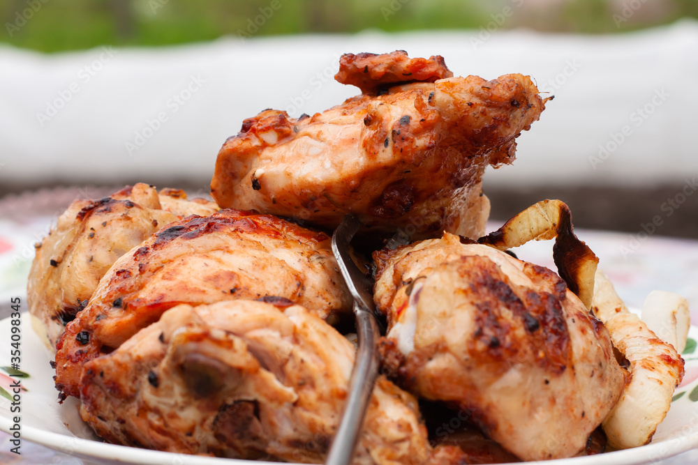 Golden fried chicken thighs. food on the grill Golden fried chicken thighs. food on the grill