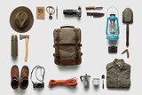 Packing backpack for a trip concept with traveler items isolated on white background
