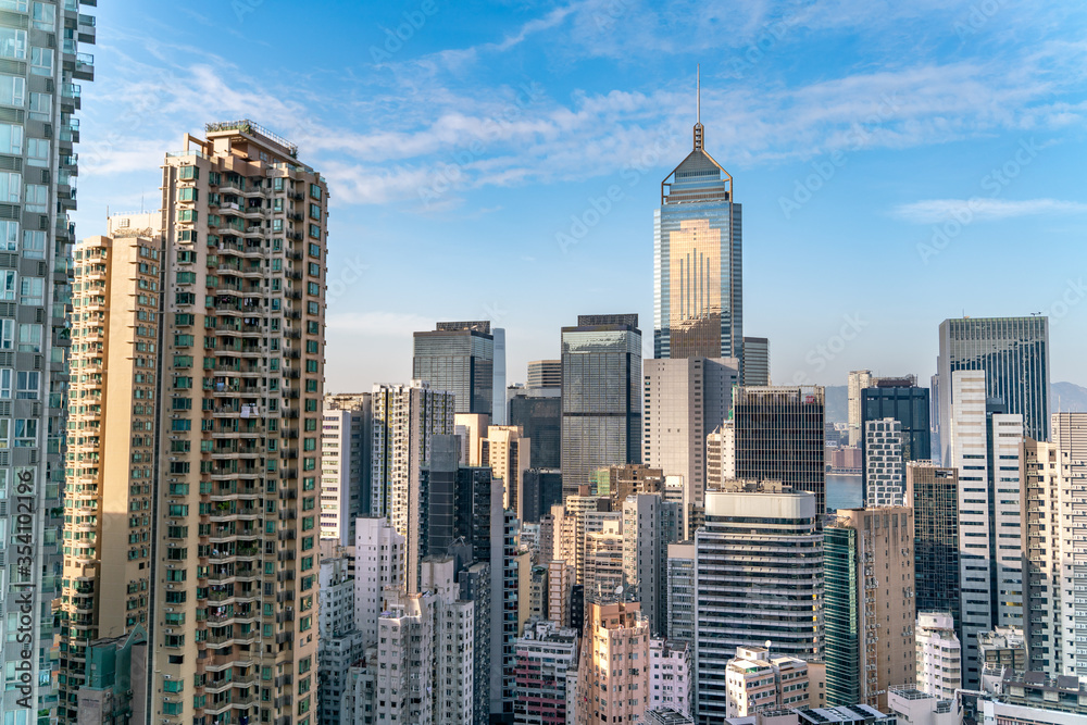 The amazing view of Hong-Kong cityscape full of skyscrapers from the rooftop.