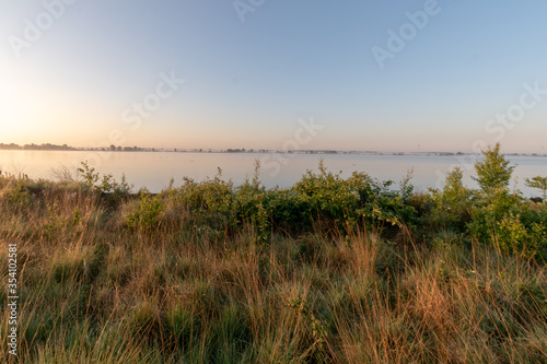 sunrise over the moor in summer with blue sky