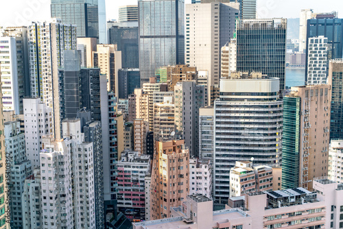 The amazing view of Hong-Kong cityscape full of skyscrapers from the rooftop.