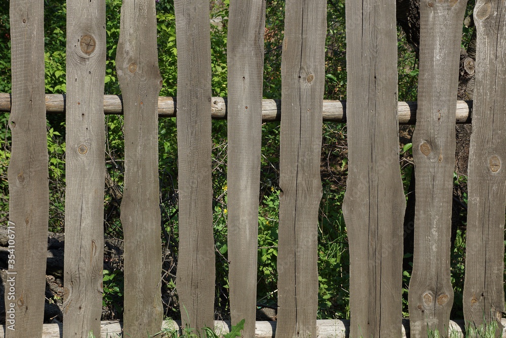 gray  wooden texture of a boards in the wall of the fence