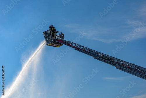 Obraz na plátně firefighter in action on the large scale