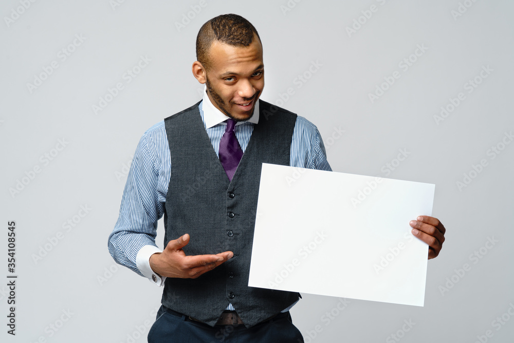 professional african-american business man - presenting holding blank sign professional african-american business man - presenting holding blank sign