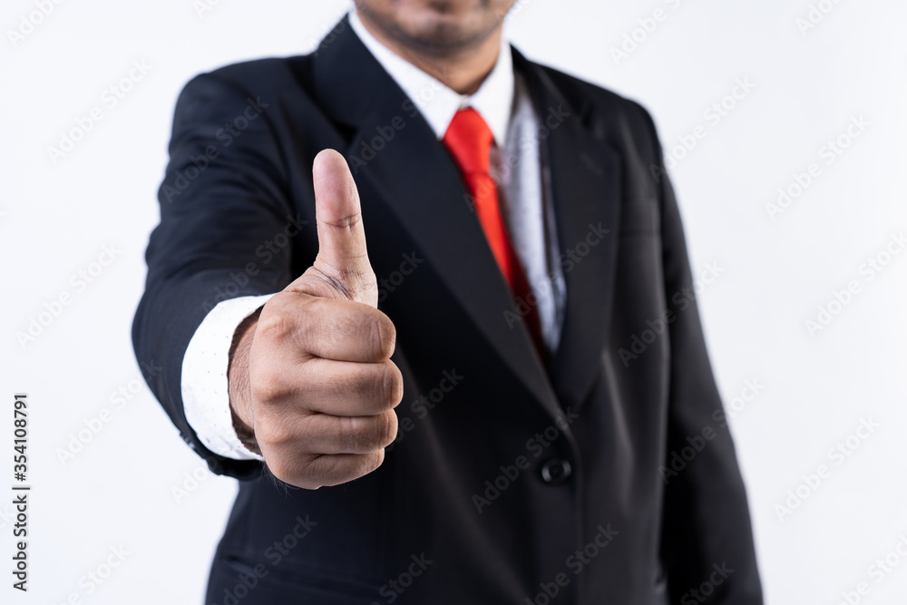 Closed up shot of a man in suit showing thumbs up Closed up shot of a man in suit showing thumbs up