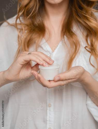 Woman in white with cream