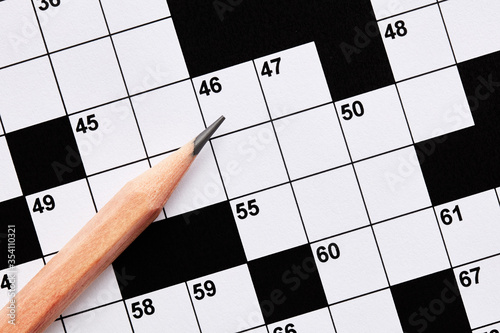 Blank crossword puzzle game with pencil photo