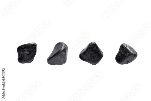 Variety of black pebble stones isolated on white