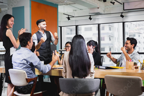 business team celebrate together in office, teamwork success win strategie meeting table