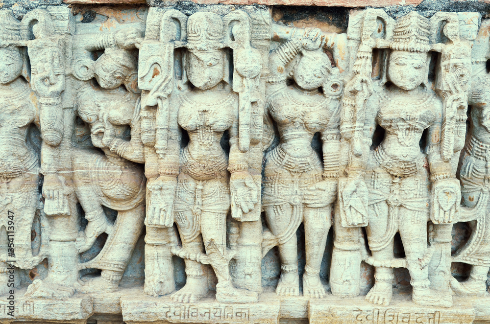 white marble bas-relief with a pattern of women on the temple wall, India white marble bas-relief with a pattern of women on the temple wall, India