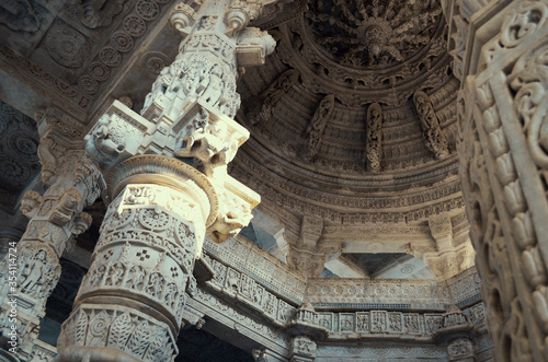 columns and ceiling of marble patterned carved white in Ranakpur temple, India