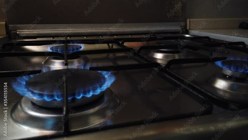 The comforts on the gas stove are lit up and extinguished The comforts on the gas stove are lit up and extinguished
