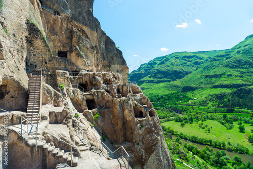 View of the ancient cave city carved into the rock - a famous attraction of Georgia Vardzia photo