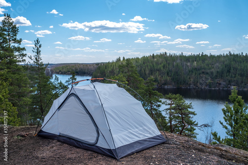 Tent in the forest on a hill