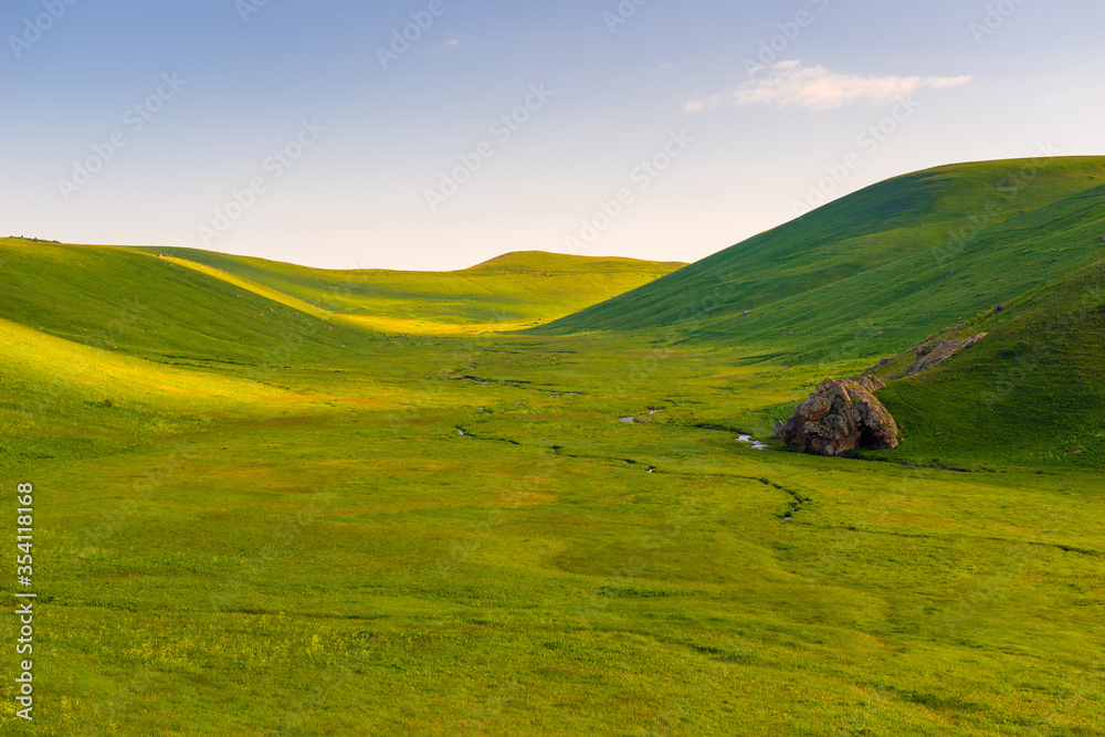 beautiful landscape on a sunny day, smooth green beautiful valley of the mountains of Armenia in June