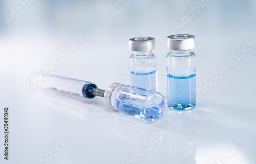 close up vaccine and syringe injection for prevention from virus infection