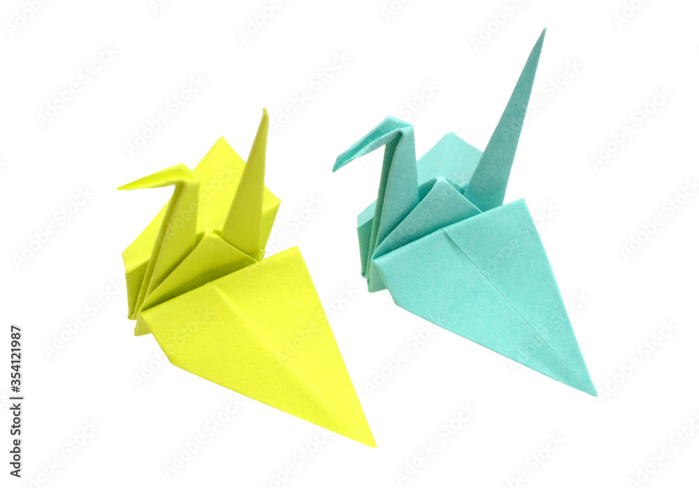 Fototapeta premium Two origami birds on a white background