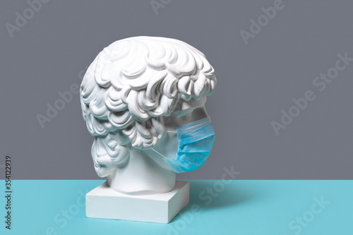 White gypsum statue of the head of Antinous photo