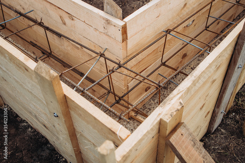 The foundation for the house, a wooden box with fittings inserted in the middle