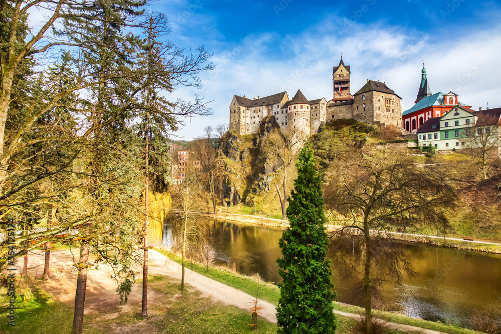 Amazing landmark in Czech Republic, near Karlovy Vary Loket middleaged castle with blue sky in spring.