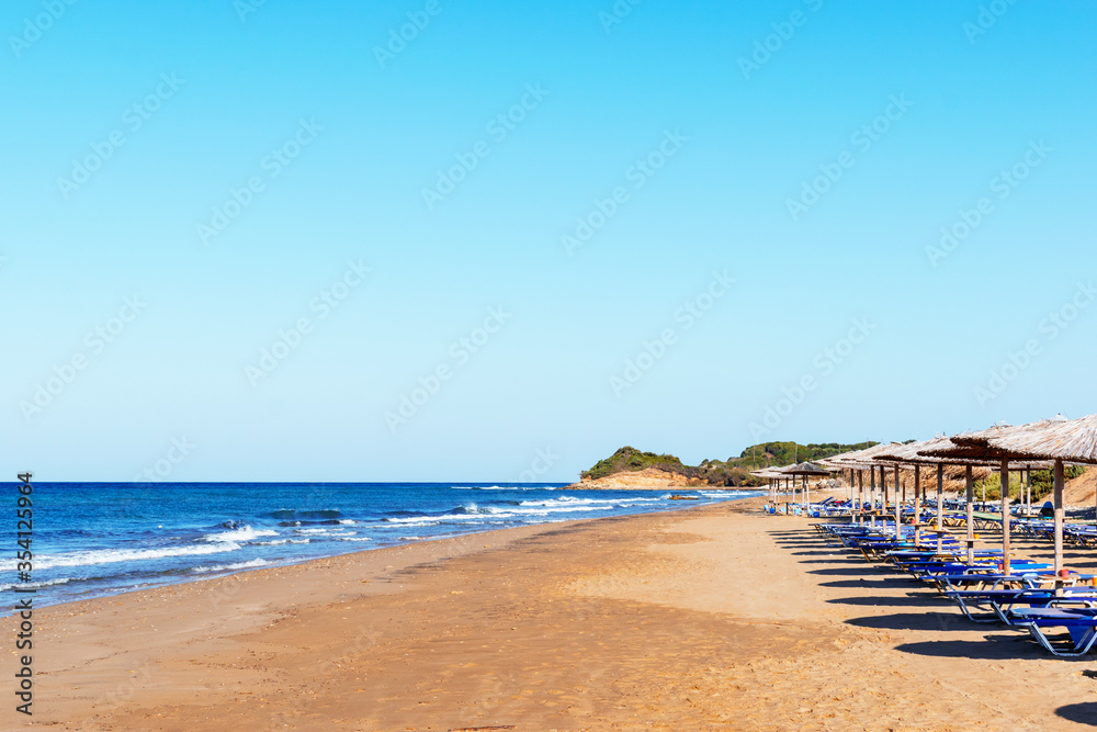View of an empty, deserted beach. Chalikounas Beach, Corfu Island. Copy space for text
