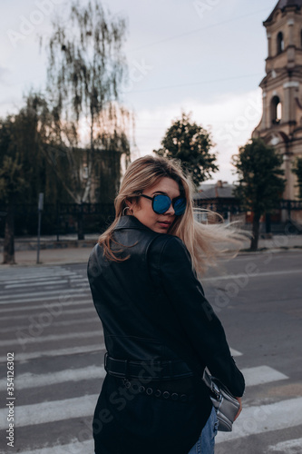 Portrait of a young girl. Photo session of a stylish girl outdoors.  © dimadasha
