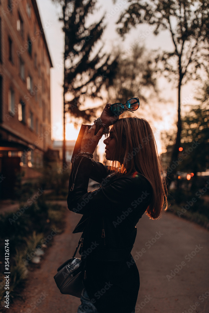 Portrait of a young girl. Photo session of a stylish girl outdoors.

