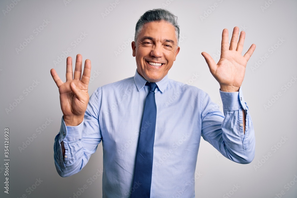 Middle age handsome grey-haired business man wearing elegant shirt and tie showing and pointing up with fingers number nine while smiling confident and happy. Middle age handsome grey-haired business man wearing elegant shirt and tie showing and pointing up with fingers number nine while smiling confident and happy.