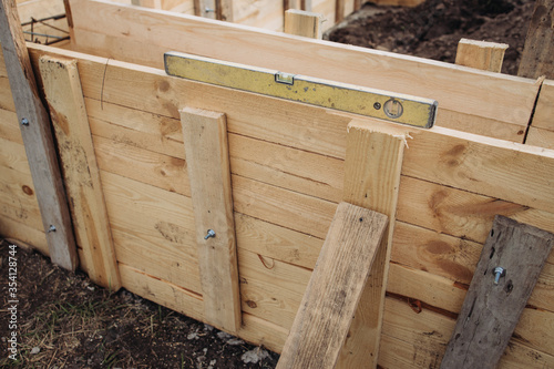 The old building level of yellow lies on the wooden formwork