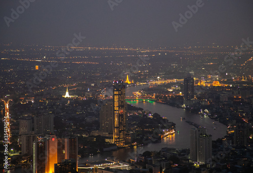 panoramic skyline of Bangkok by night from King Power Mahanakhon, Bangkok, Thailand