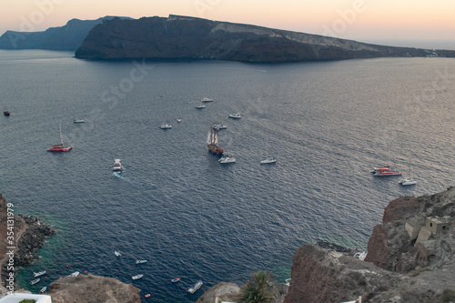 Shot of a number of sailing ship at the Caldera of Santorini