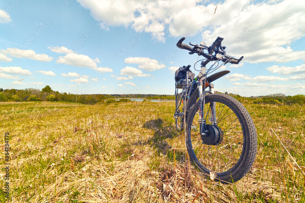 Electric bike standing in the summer field