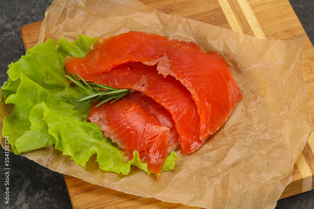 Sliced salmon fillet served rosemary Sliced salmon fillet served rosemary