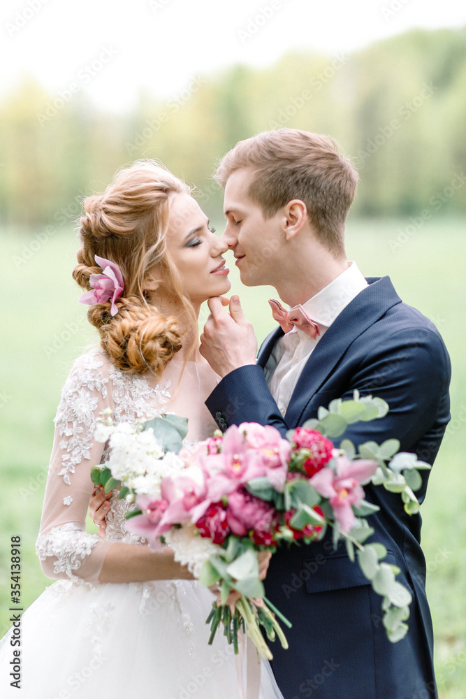 Wedding ceremony. The groom kisses the bride. Beautiful couple. Wedding ceremony. The groom kisses the bride. Beautiful couple.