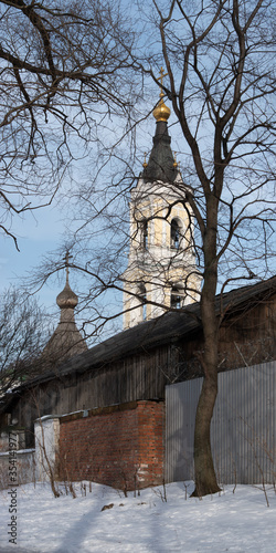 Kosino, Moscow Region, Russia - February 2016. Church of the Assumption of the Blessed Virgin Mary. Founded in 1823. Exterior of very beautiful monastery on the shore of Lake Beloe. photo