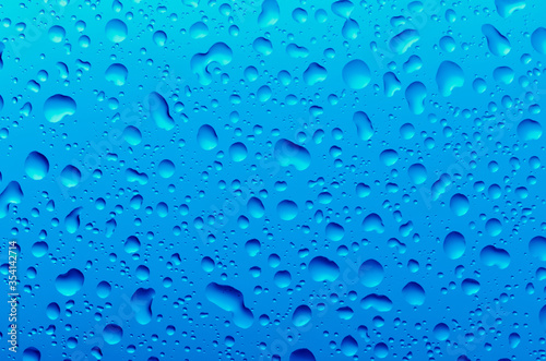 Drops of water on a blue background