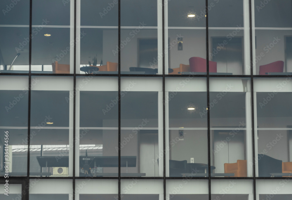 Offices in glass building in Pilsen city in wet rainy cloudy day Offices in glass building in Pilsen city in wet rainy cloudy day