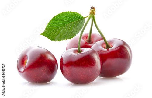 Sweet cherry with leaves on white background