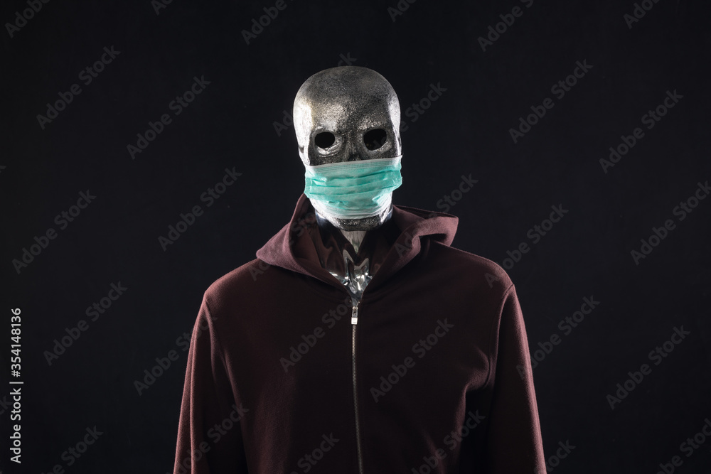 monster in a medical mask in a hood monster in a medical mask in a hood