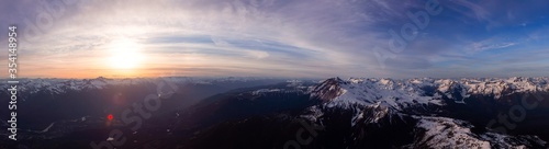 Aerial Panoramic View of Canadian Mountain Landscape during a colorful sunset. Located near Squamish, North of Vancouver, British Columbia, Canada. Nature Background Panorama