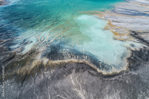 Industrial coal mine, abstract sendimentation tank of power plant , turquoise water like river delta photo