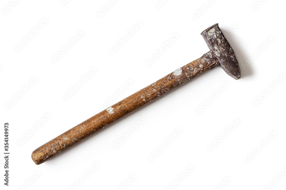 An old battered hammer with a wooden handle An old battered hammer with a wooden handle